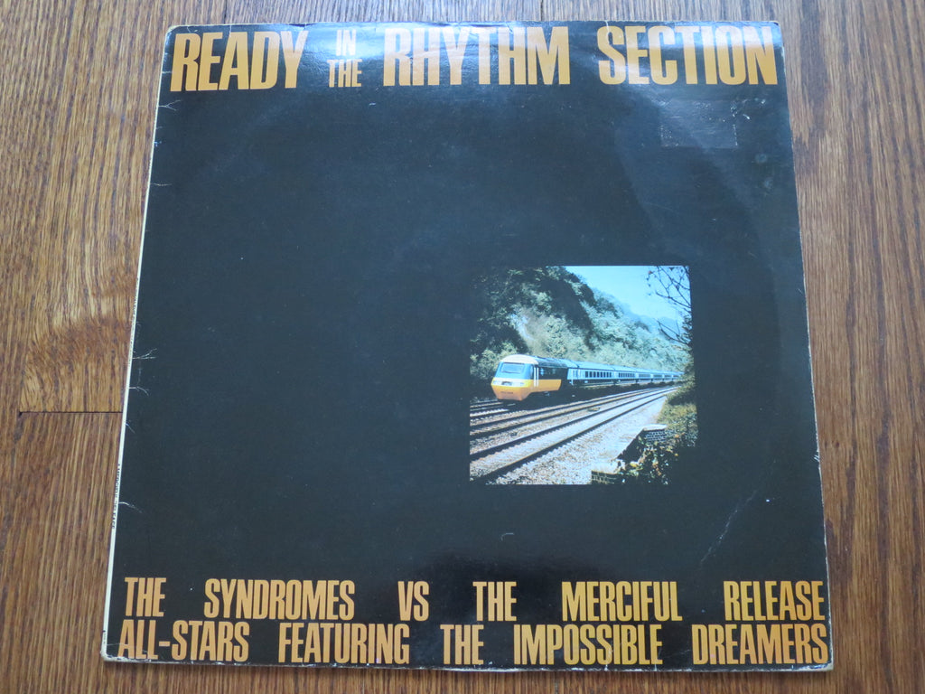 The Syndromes Vs The Merciful Release All-stars Featuring The Impossible Dreamers - Ready In The Rhythm Section - LP UK Vinyl Album Record Cover